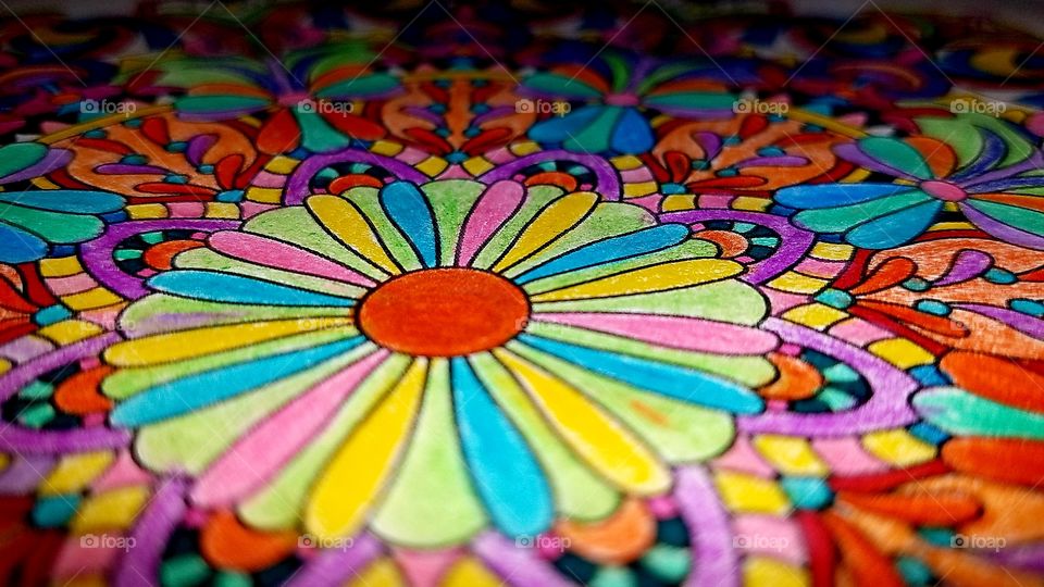 closeup of a colored pattern in coloring book.