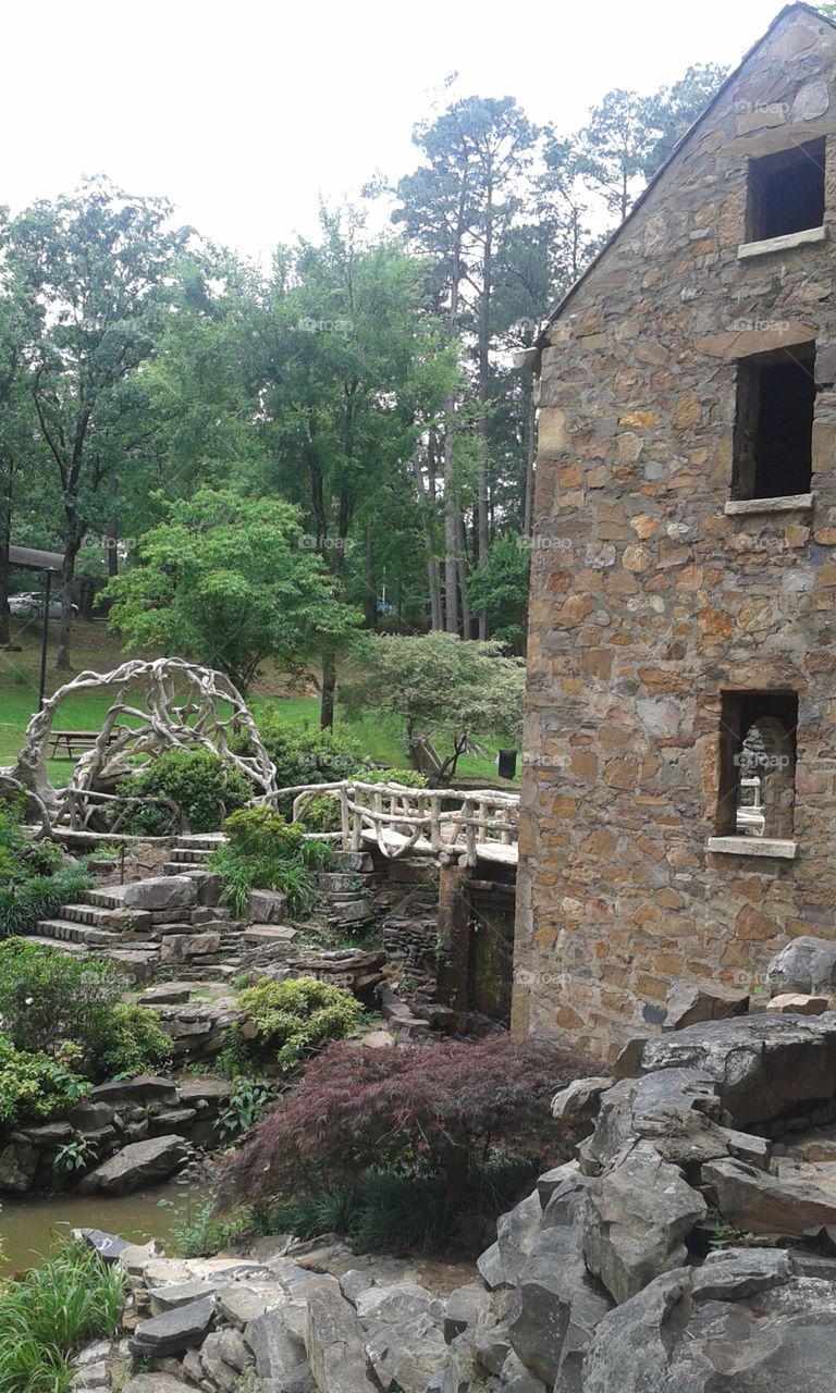 Old Mill Garden. Little testing area with tree bench and couple bridges next to the Old Mill in Little Rock Arkansas.
