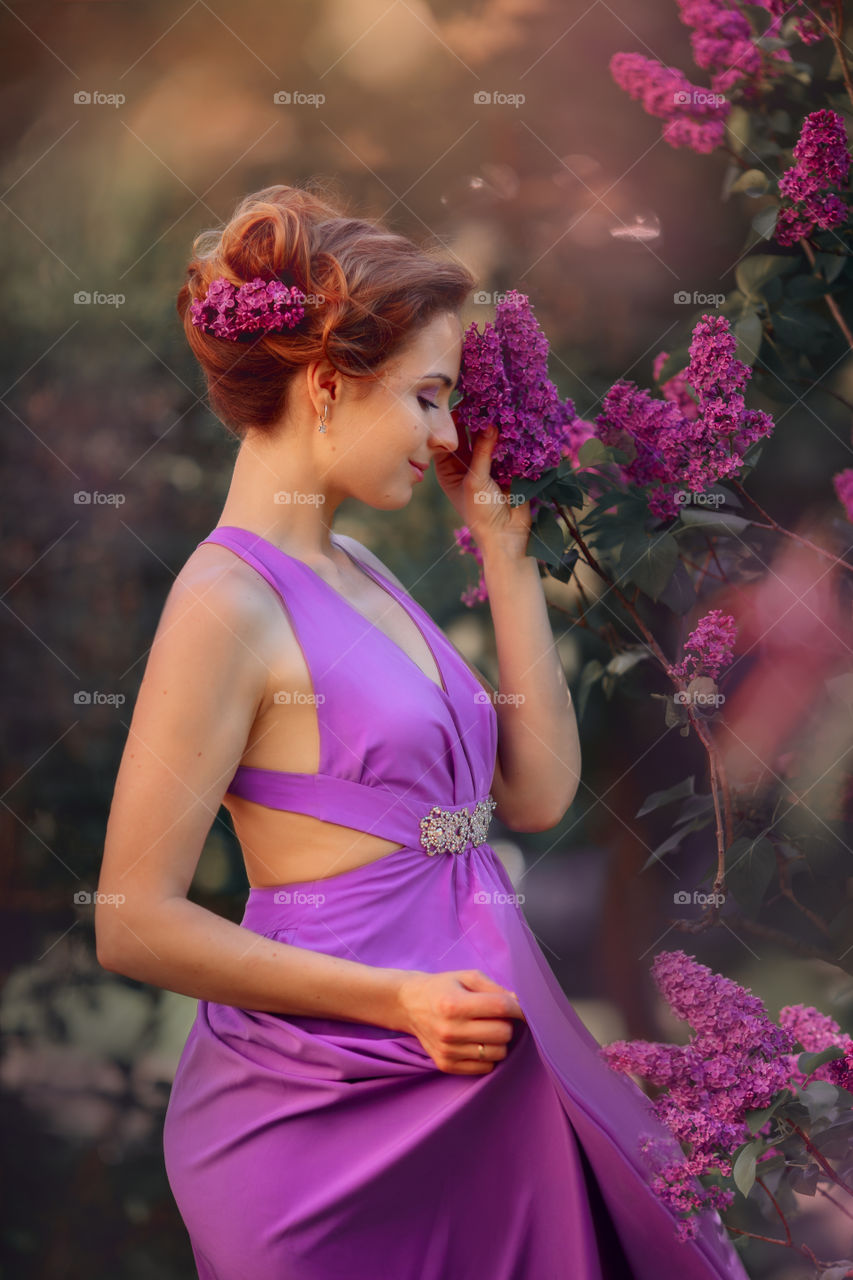 Beautiful young woman in lilac 