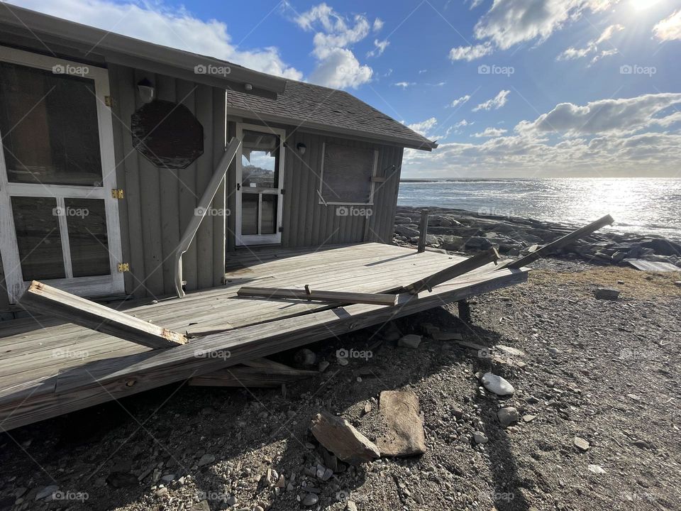 A house is ripped off its foundation and deposited after a powerful coastal storm came through New Harbor, Maine.