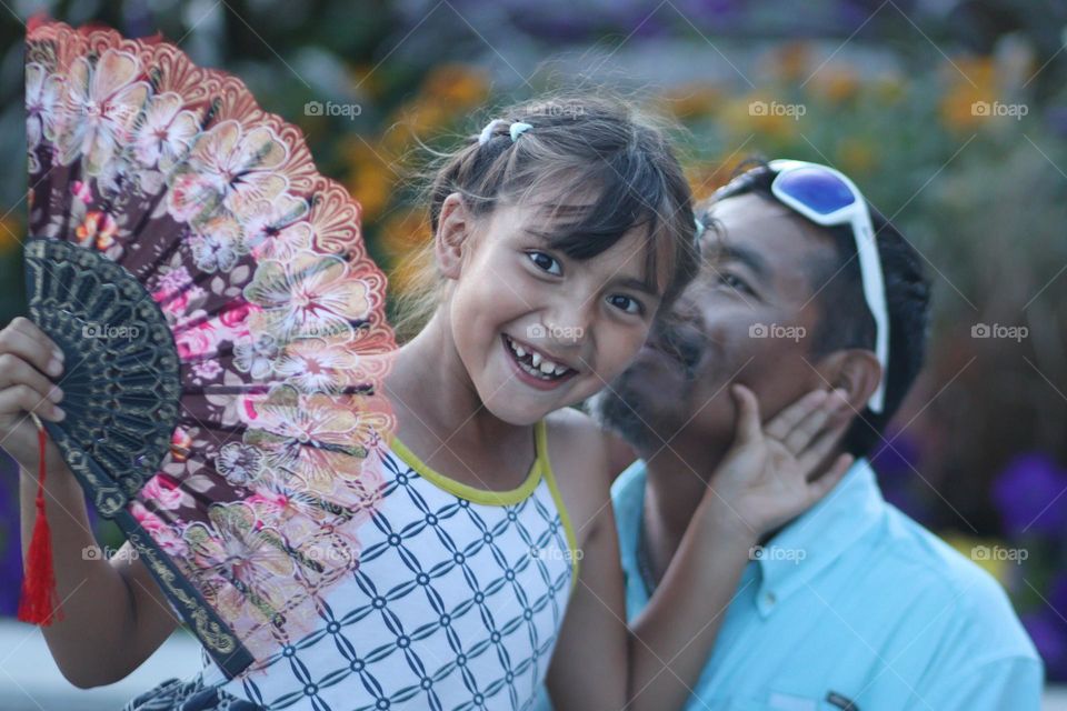 Father and daughter are having fun together