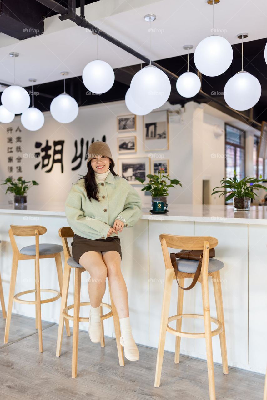 Woman in modern cafe