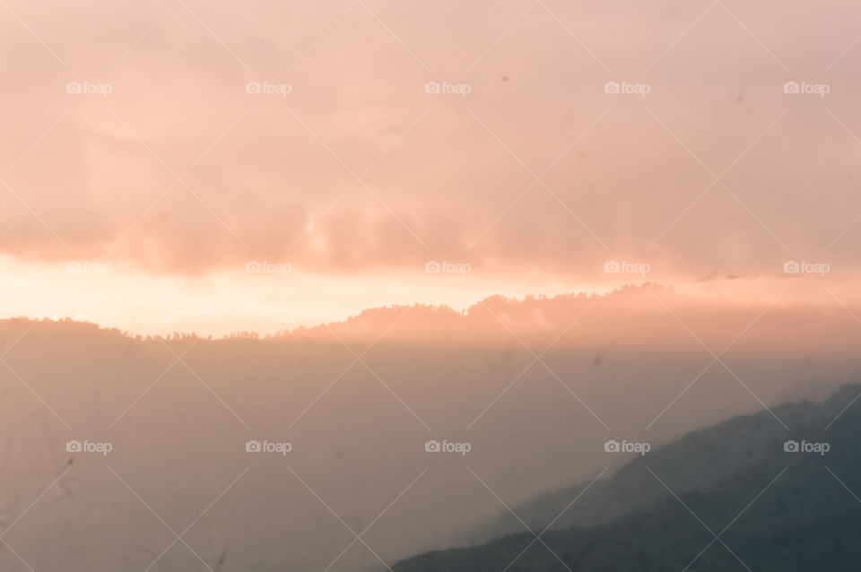 Gorgeous panorama scenic beauty of the sunset with colorful clouds on orange sky. Heavenly Sky background on Sunset and sunrise. Nature composition.