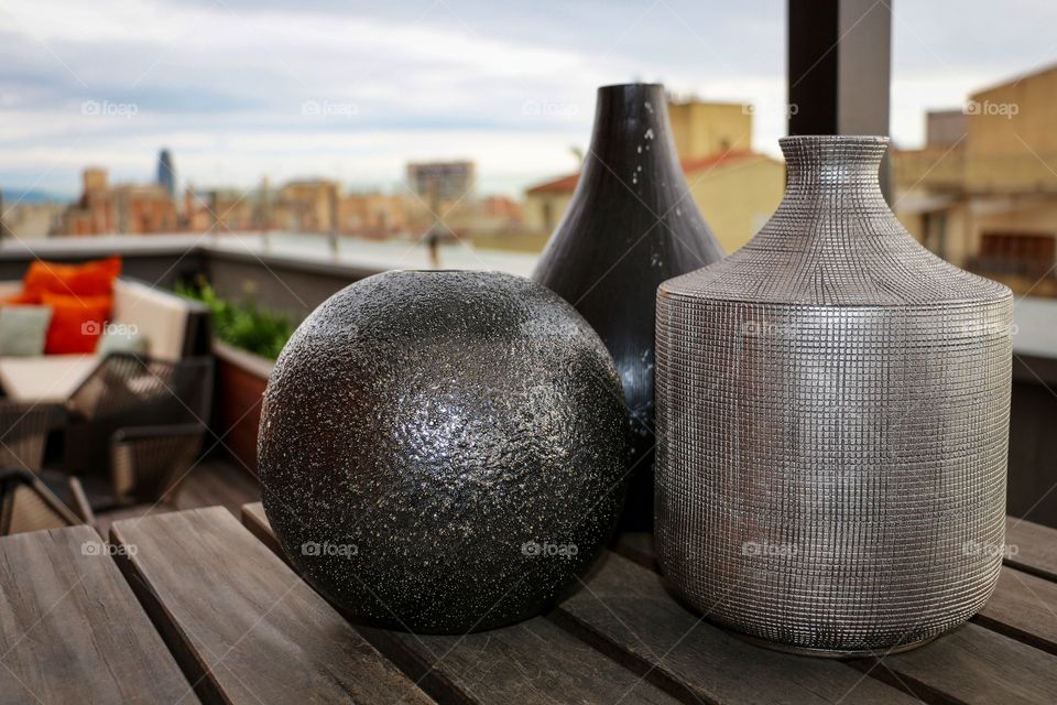 Beautiful vases well-arranged on the wooden table 