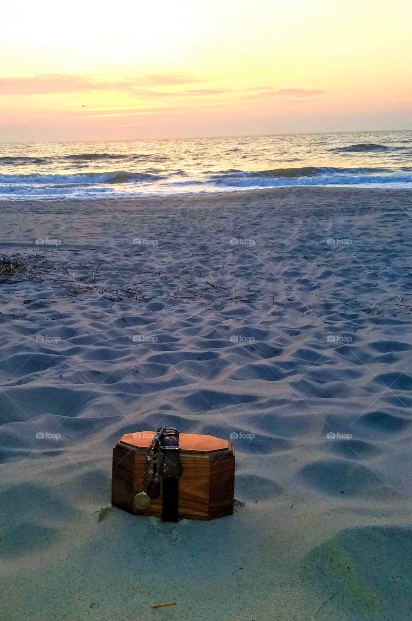 My dog and I used to watch the sun rise at the beach quite often. After he was killed and cremated I carried him with me to watch it rise again together. Gabriel is in the box w/ me sitting behind him.