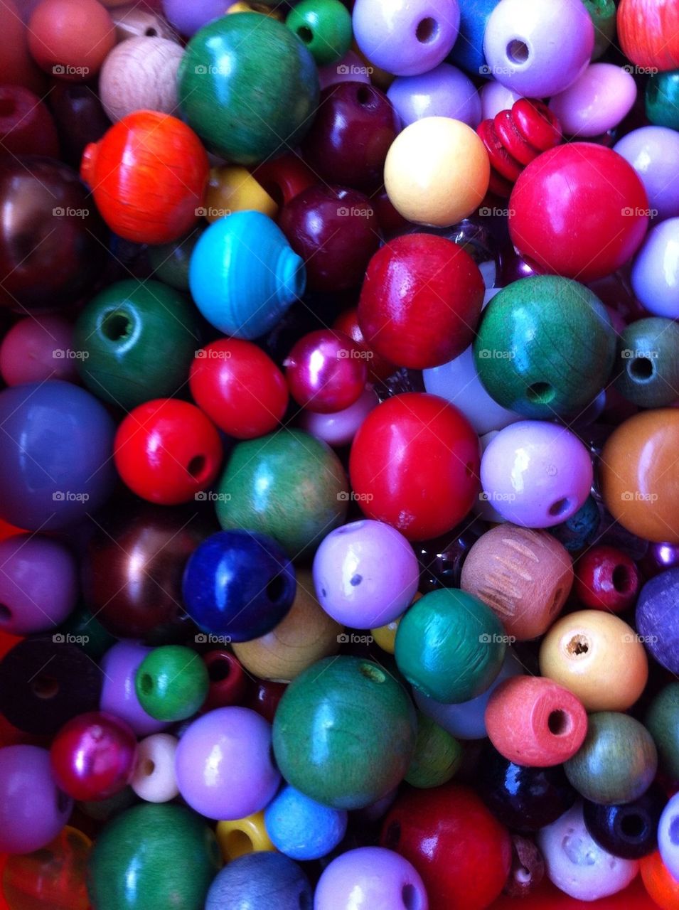 Wooden pearls in assorted colors.
