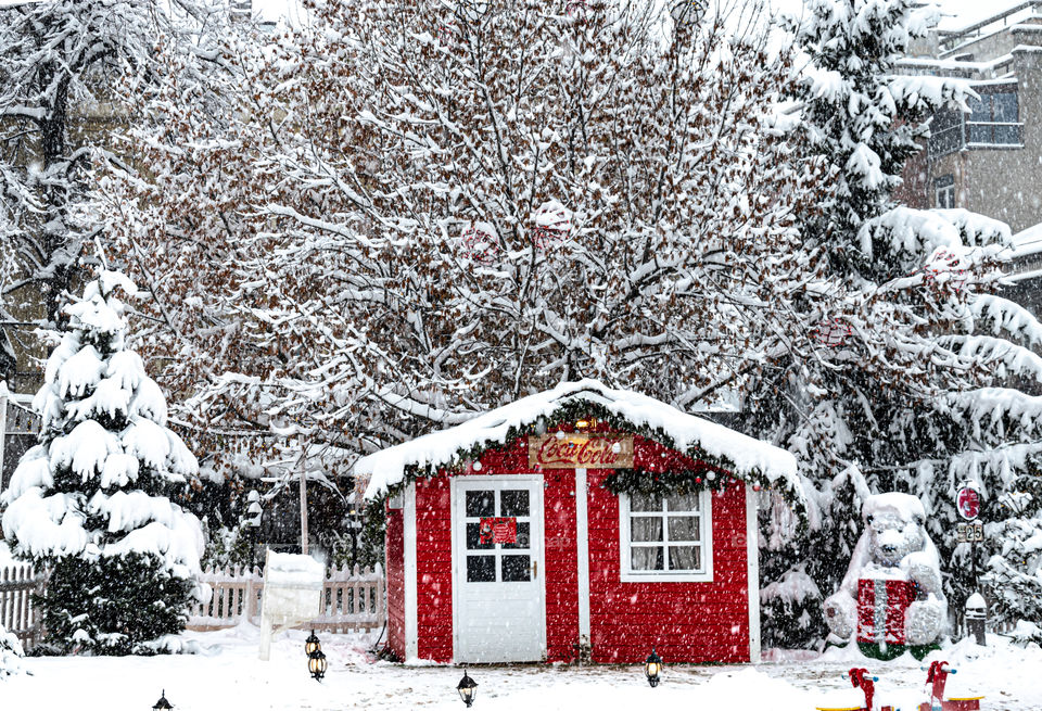 Coca-Cola winter house under the snow