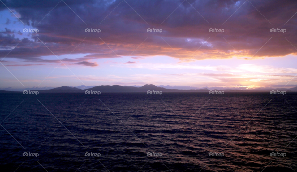 ocean sky sunset clouds by adrianocastelli