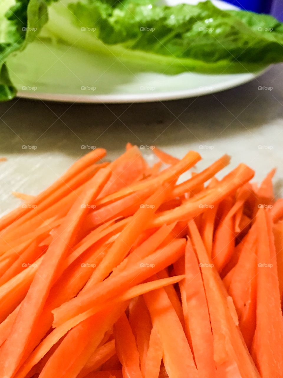 Thin slices carrot sticks closeup