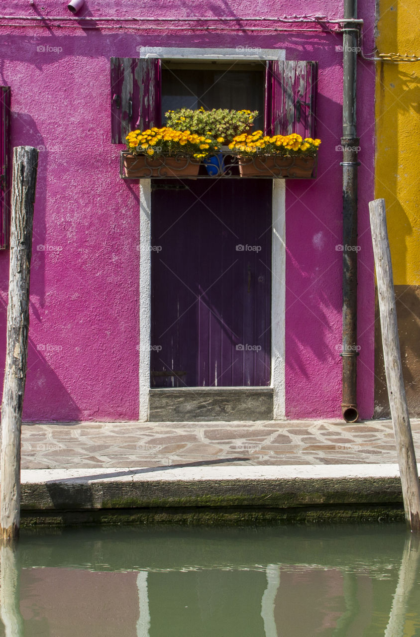 Door of the pink house at the canal