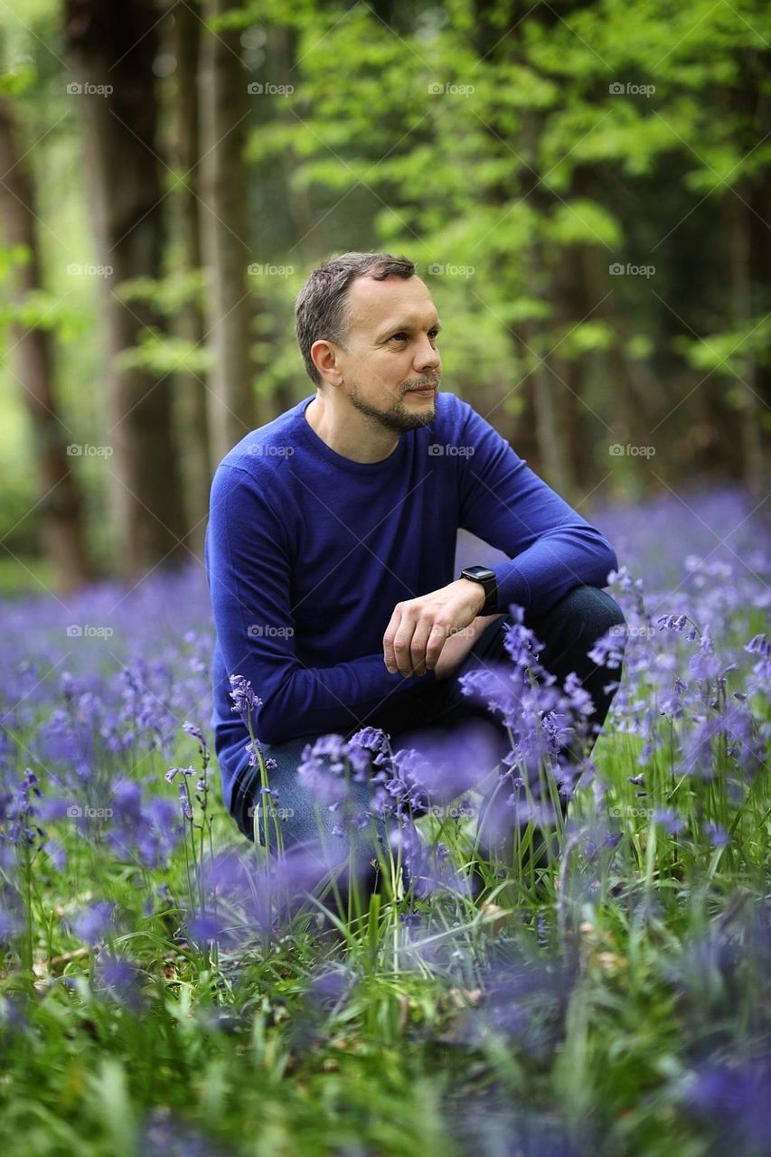 It is unusual to see a man against the background of flowers, but in the spring it is so beautiful in the forest that if you take a camera with you, but there is no model, then why not take a picture of your husband among the beautiful forest bells.