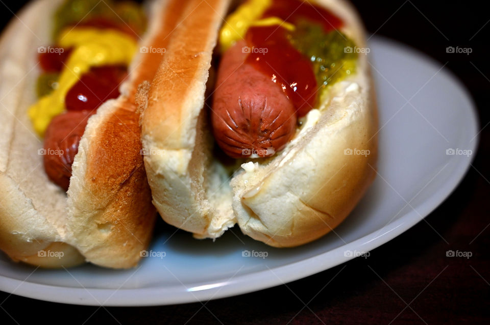 The vegetarian hotdog snacks at home. 