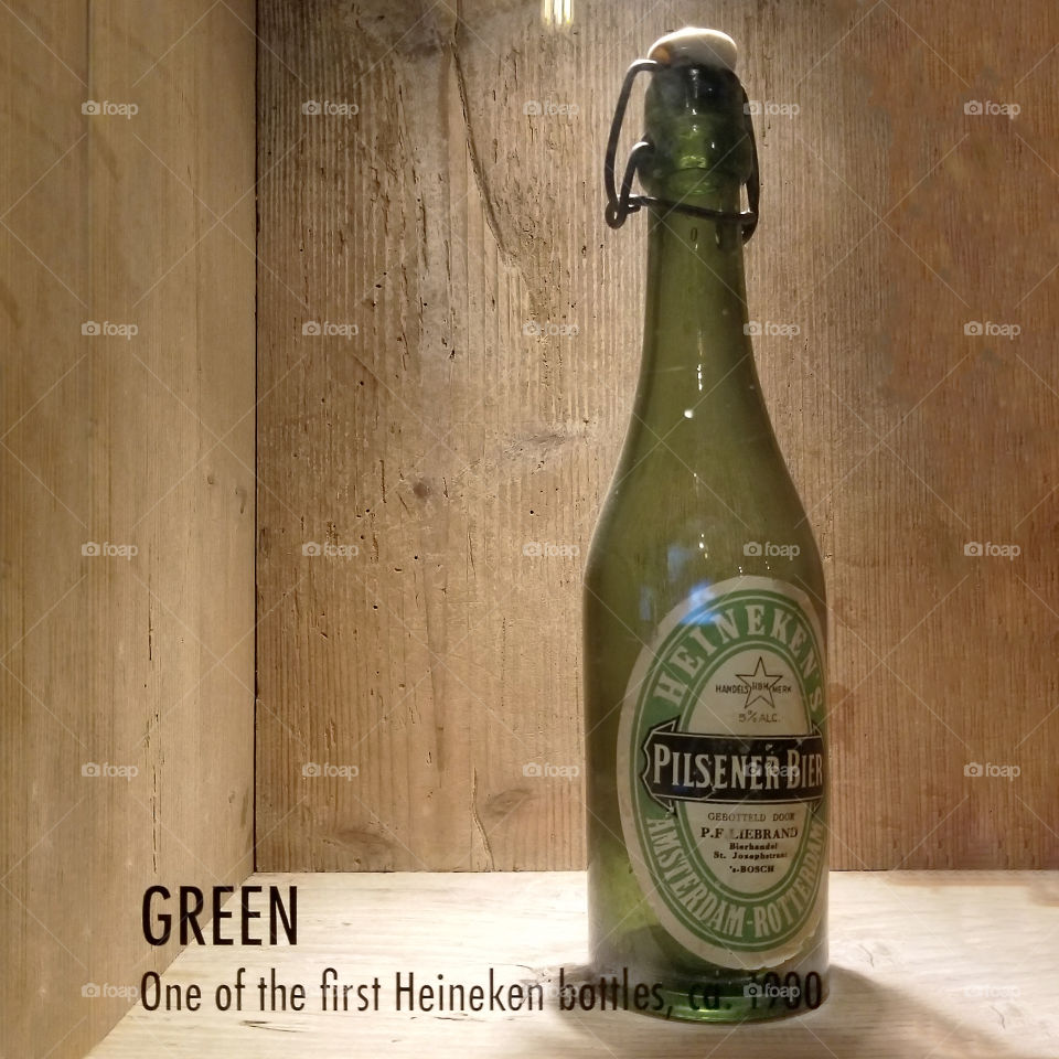 A Heineken beer bottle on display in the Heineken Experience in Amsterdam, Netherlands. This is one of the very first Heineken beer bottles.