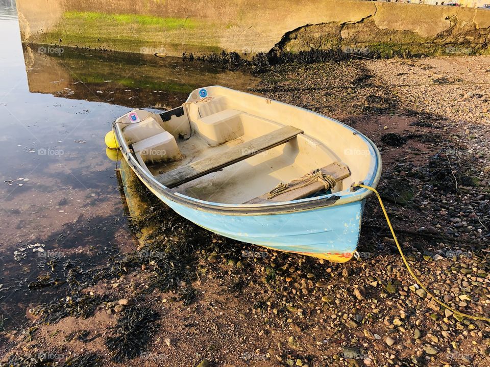 A typical small fishing vessel but moored against a somewhat battered sea wall, that actually enriched this small vessel.