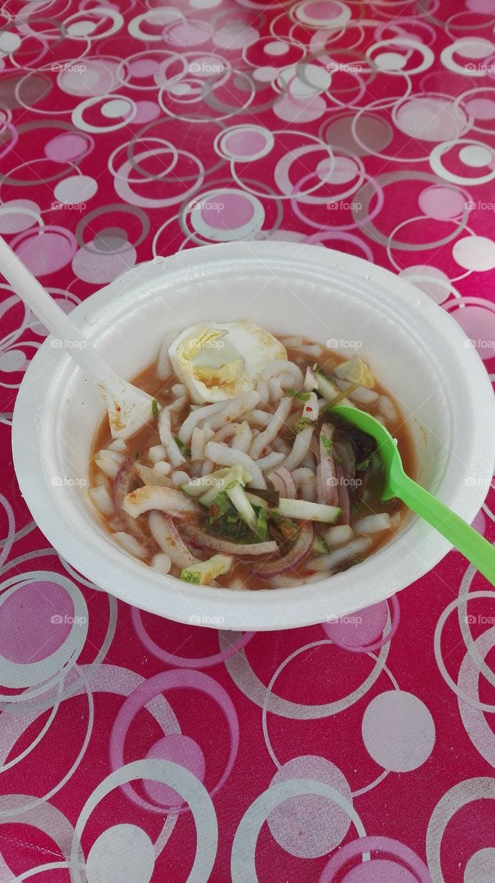 Laksa Penang, Langkawi

it was our first family trip, September 2016

Penang Laksa, a dish of thick round rice noodles in a spicy and sour tamarind or assam fruit fish soup and garnished with cucumber, onions, shreadded lettuce and half boiled egg...