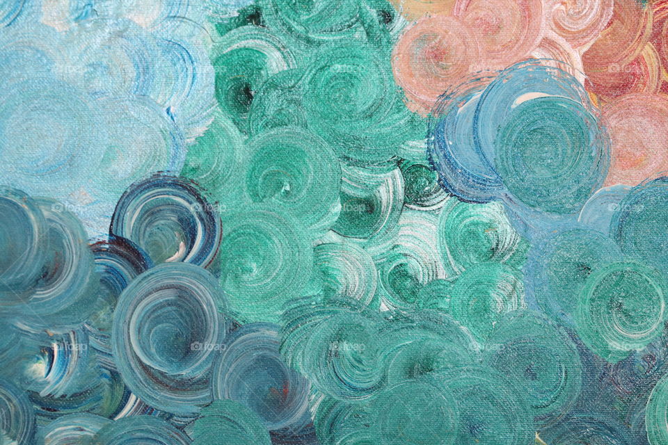 Round swirls of paint in many colours 