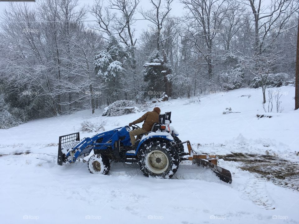 During a first day of spring snowstorm in Virginia my husband got on his tractor to clear the driveway. 
