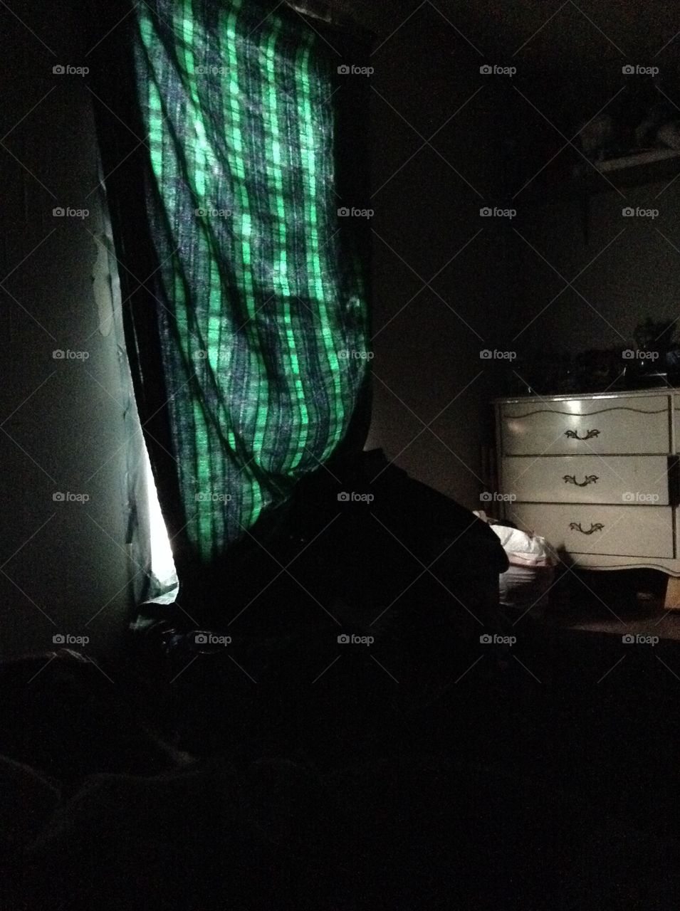 Dark room with green glow