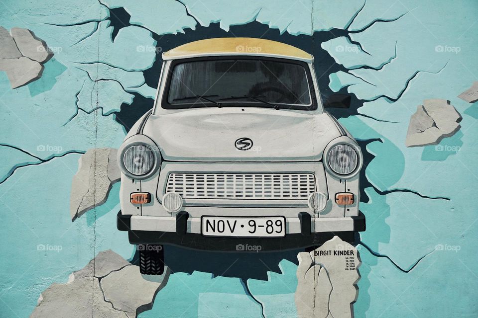 Street art … car exploding through a wall !