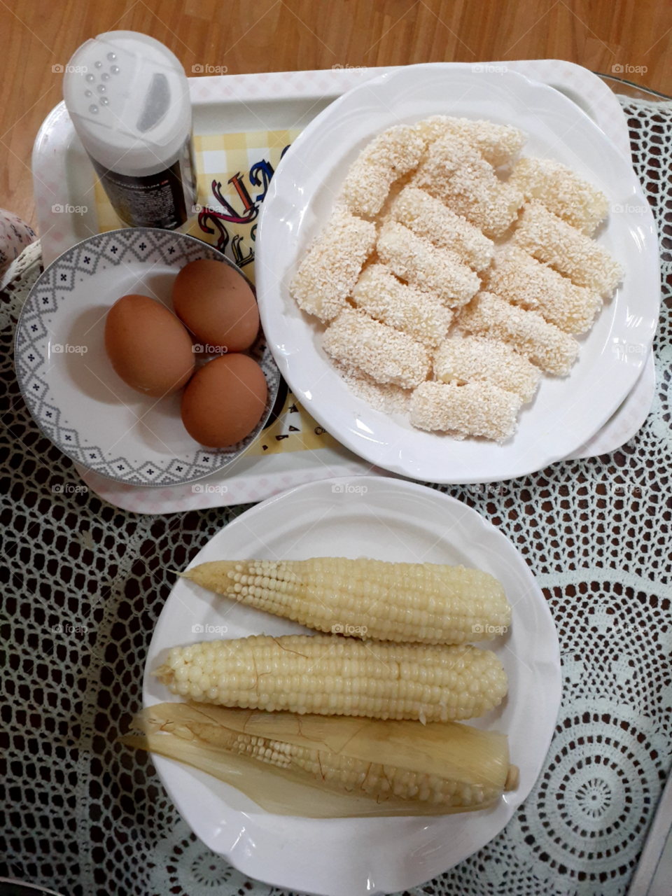 boild sweet corn, boild egg, sweet crispy snacks for morning.