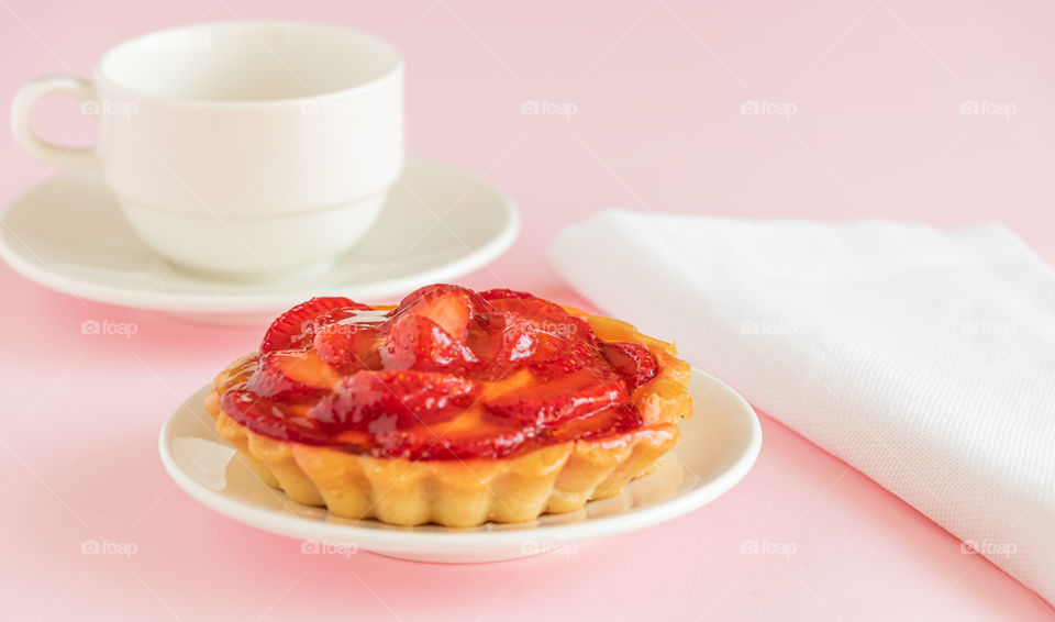 Coffee time with strawberry tart.