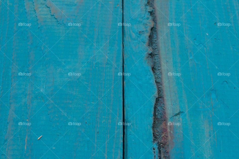 A close up of a blue wooden board