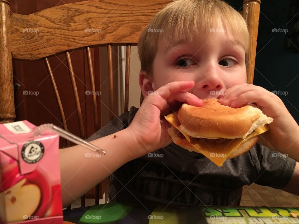 Boy eating burger