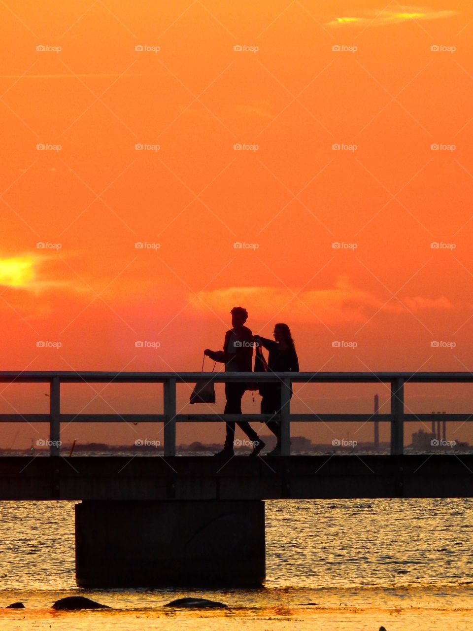 Silhouettes on a jetty