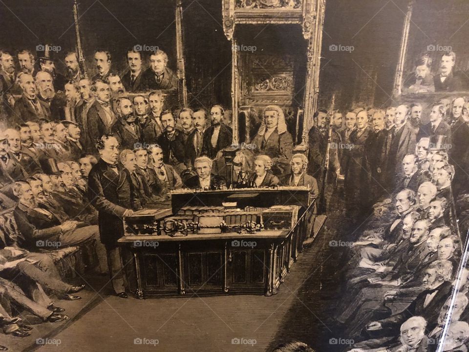 A century old sepia photo, giving us an idea of what parliament in the UK was like.