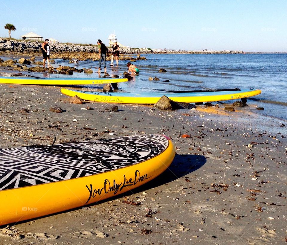 You only live once. Paddle board beach day. 