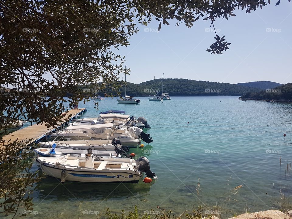 boats on the sea, photographed from the beach