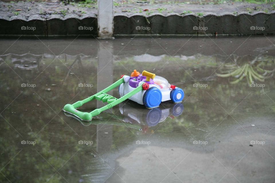 Lonely toy in the rain