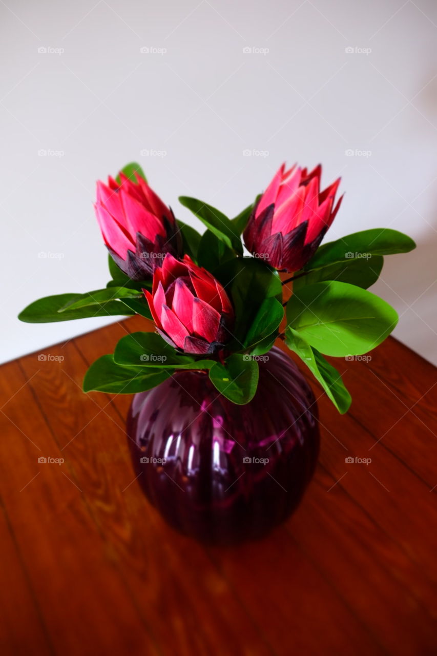 Pink Flowers In A Purple Vase On A Table, Room Staging