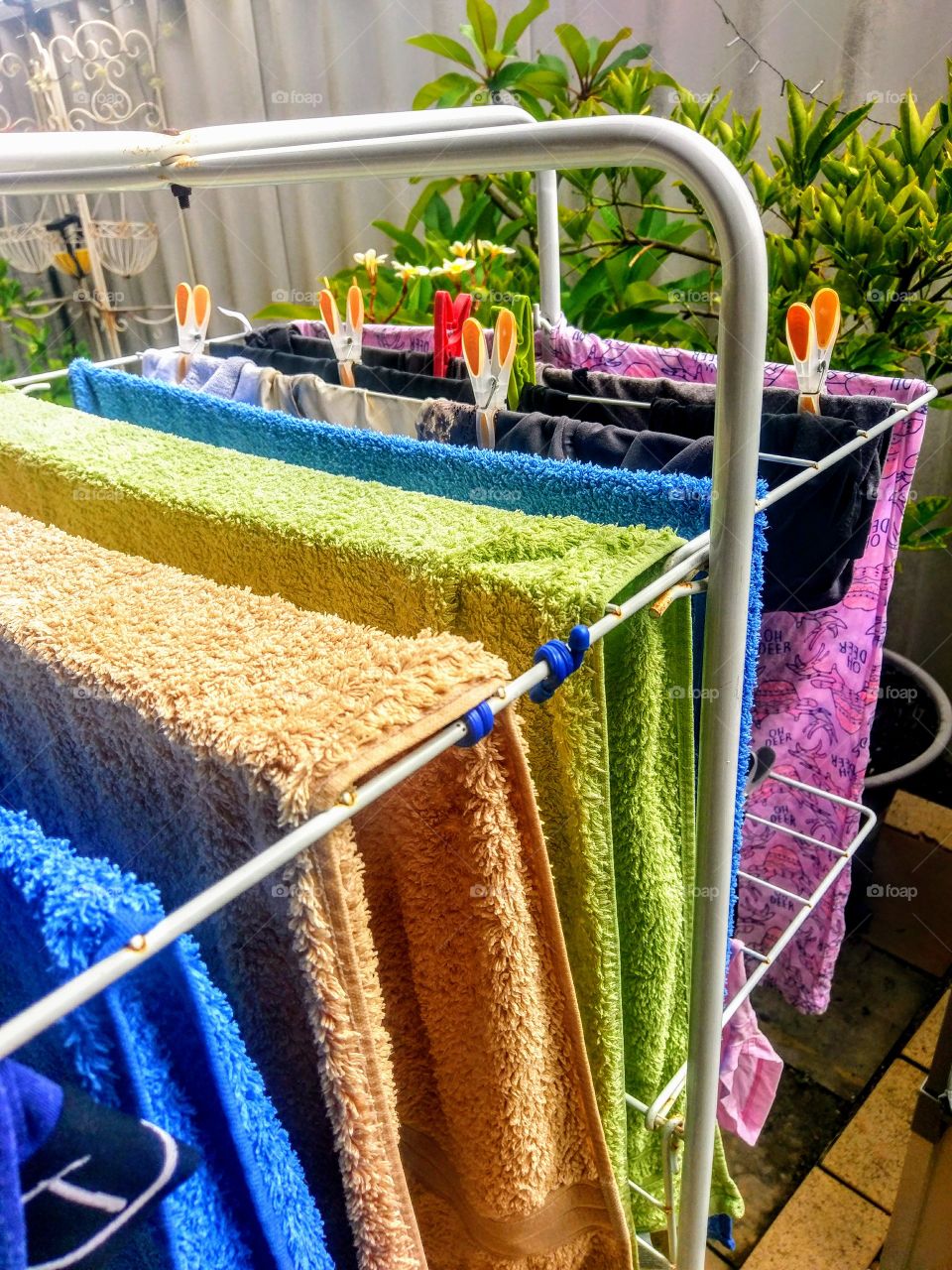 Washed colorful towels for drying outdoors