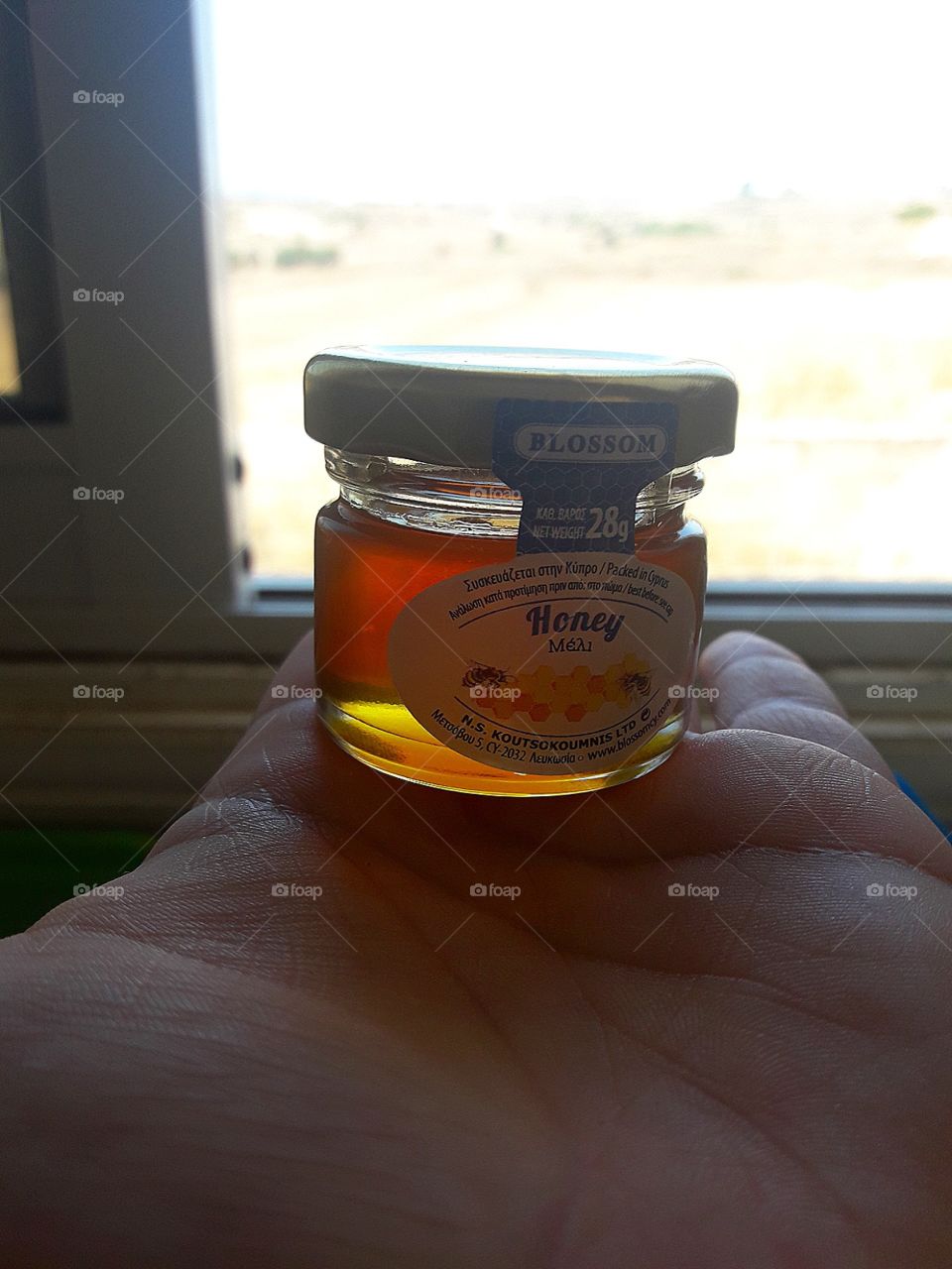 little class container with honey