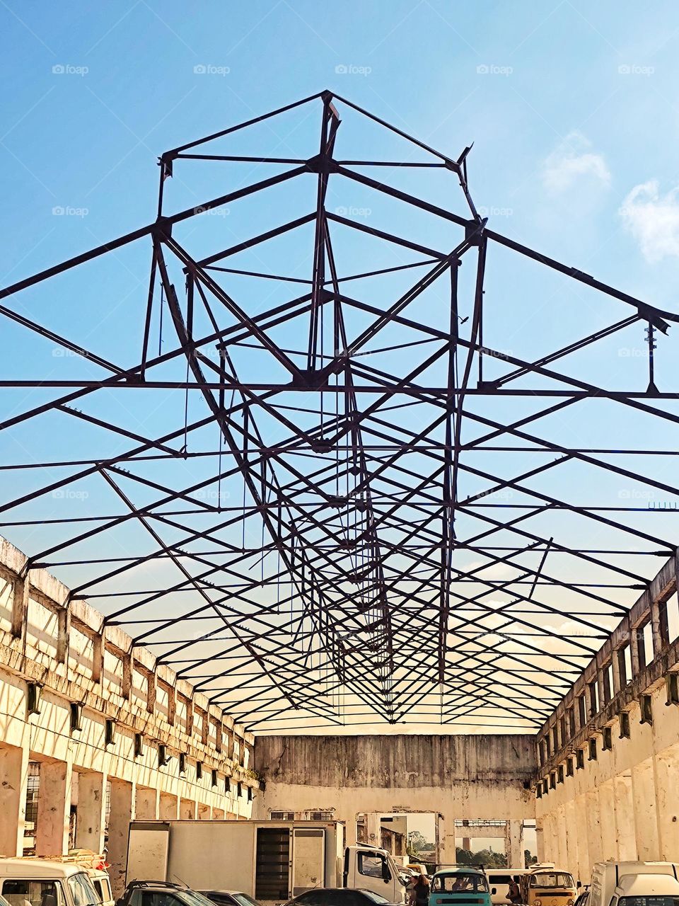 metal structure of the roof of the old railway network shed.