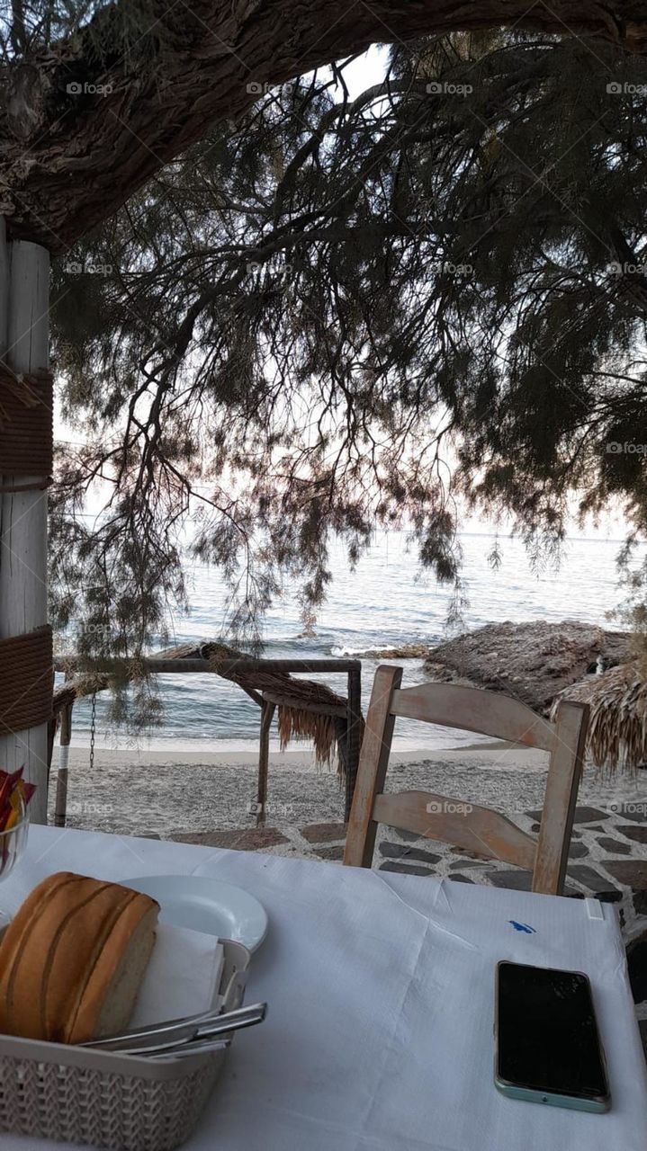 soft beach scene from dining table looking over. beige soft tones
