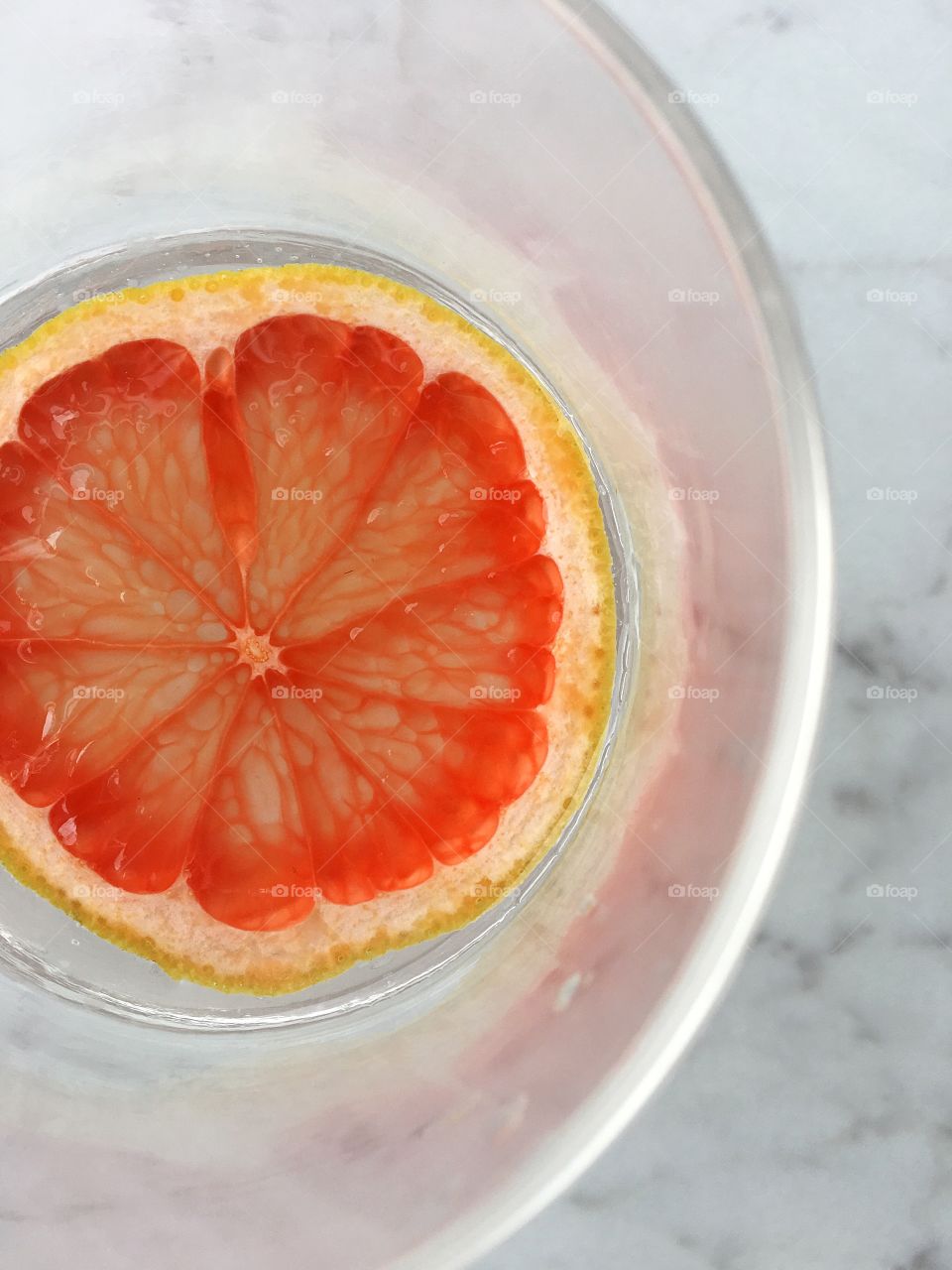 Grapefruit slices make refreshing citrus water.