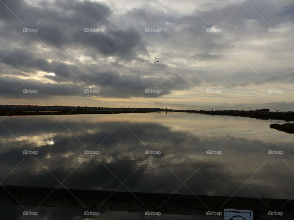 Reflecting stormy sky over Bolsa Chica 