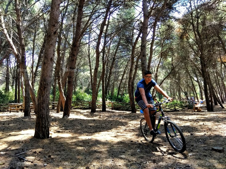 Young man with bicycle in the Park