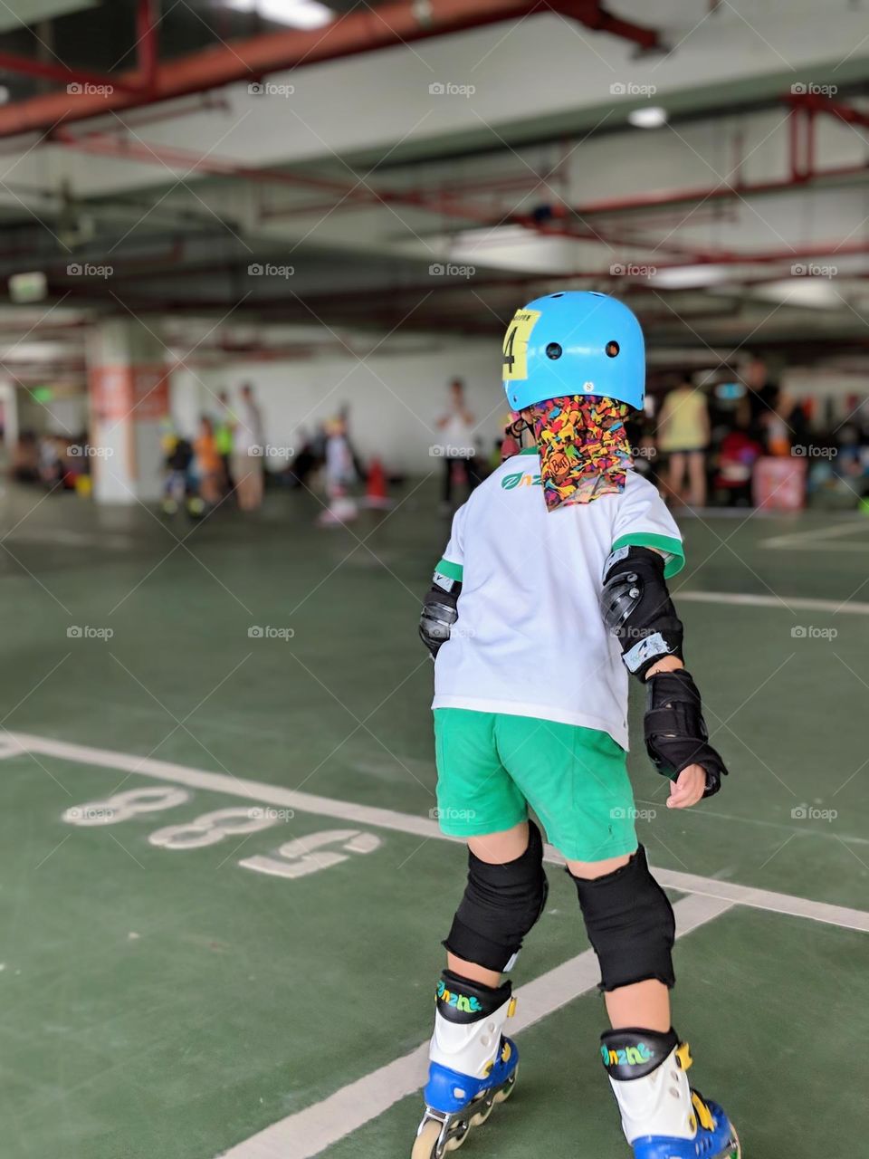 The boy is practicing inline skating