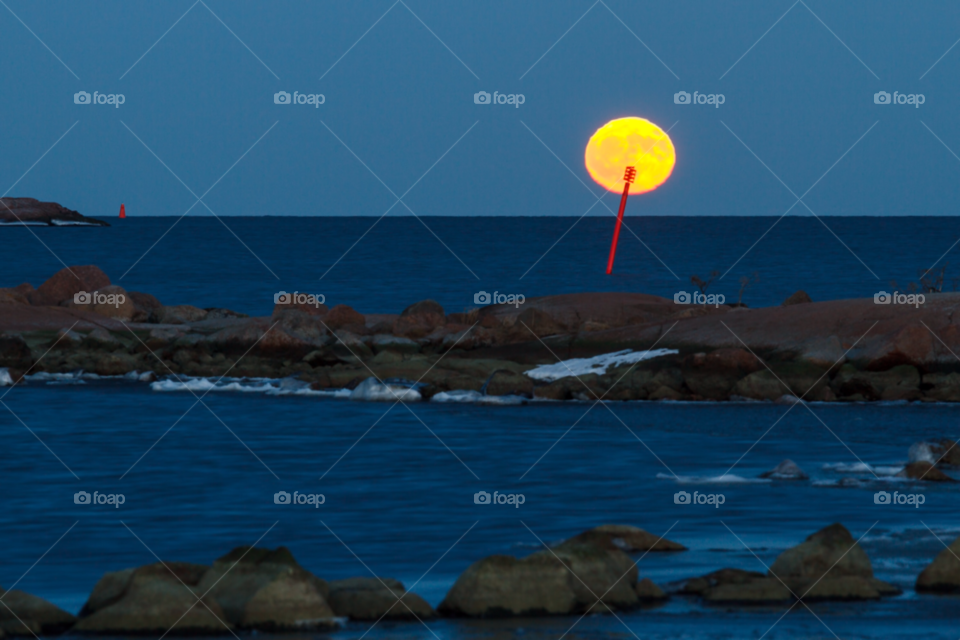 rocks dusk baltic sea full moon by cls