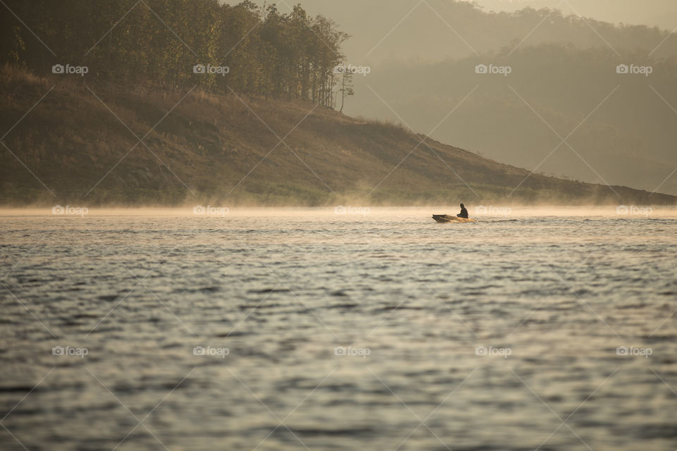 Boat in the river with mist