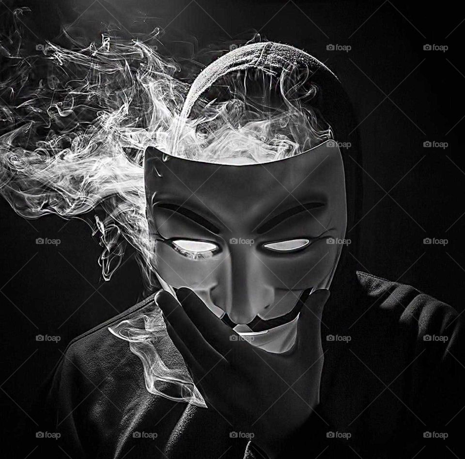 The face hidden behind the mask but the smoke covers it ...