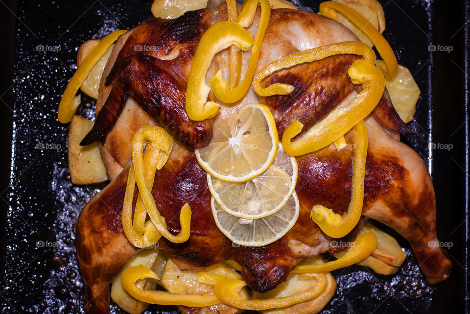 High angle view of roasted chicken and vegetables