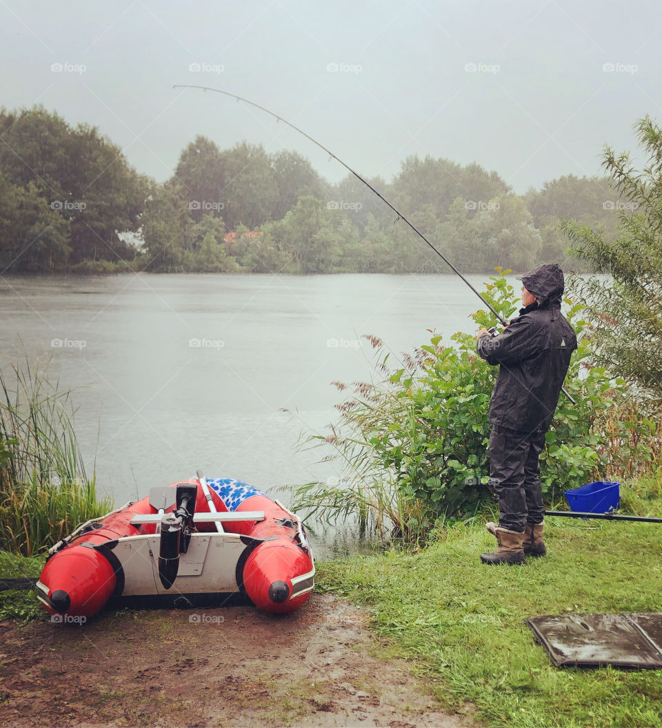 Fisherman in the rain 