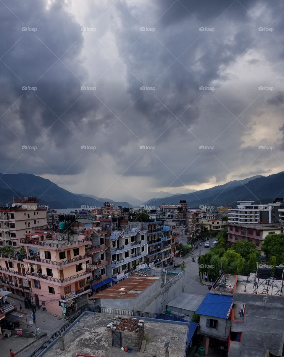 rainstorm over colorful nepal city