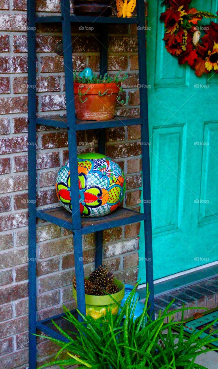 Plants and ceramics on the front porch