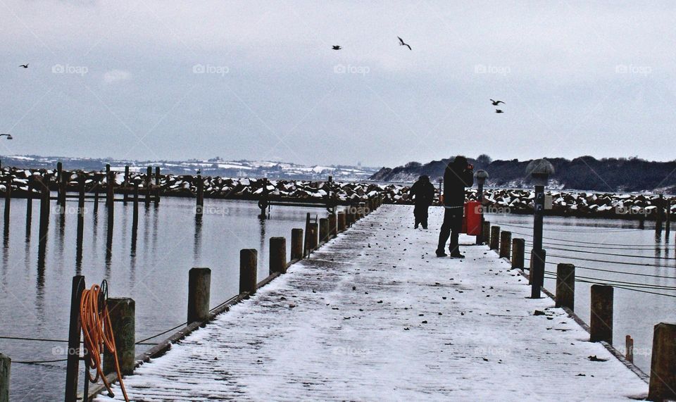 people at the pier in winter