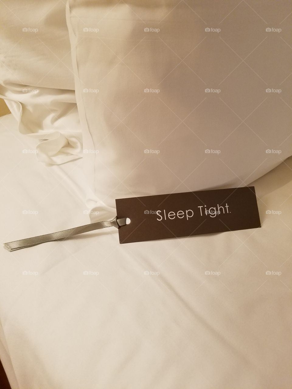 picture of bed turned down sleep tight. great for businesses